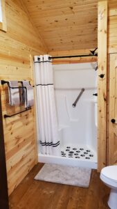 Shower stall in Honeybear Hideout log cabin