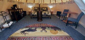 Wide angle view of tipi interior showing all amenities