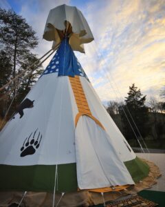 Exterior of tipi showing rain cap for keeping rain out